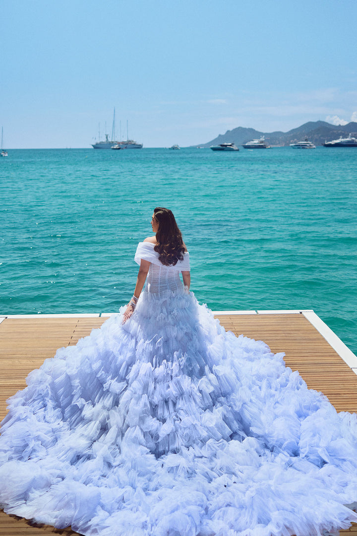 corsetted off shoulder draped gown