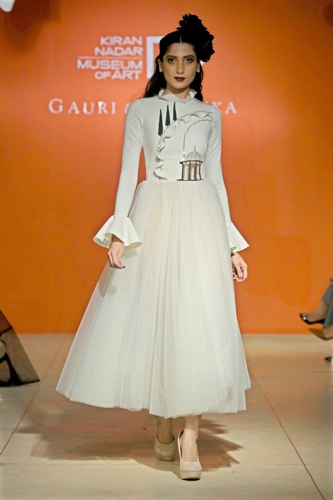 Full sleeve tea length dress with tulle skirt & small tulip path