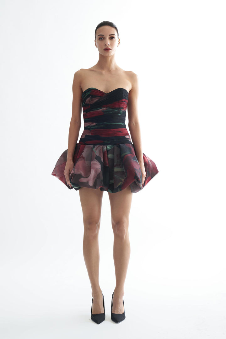 Strapless drop waisted mini dress with fluted corset and draped bodice
